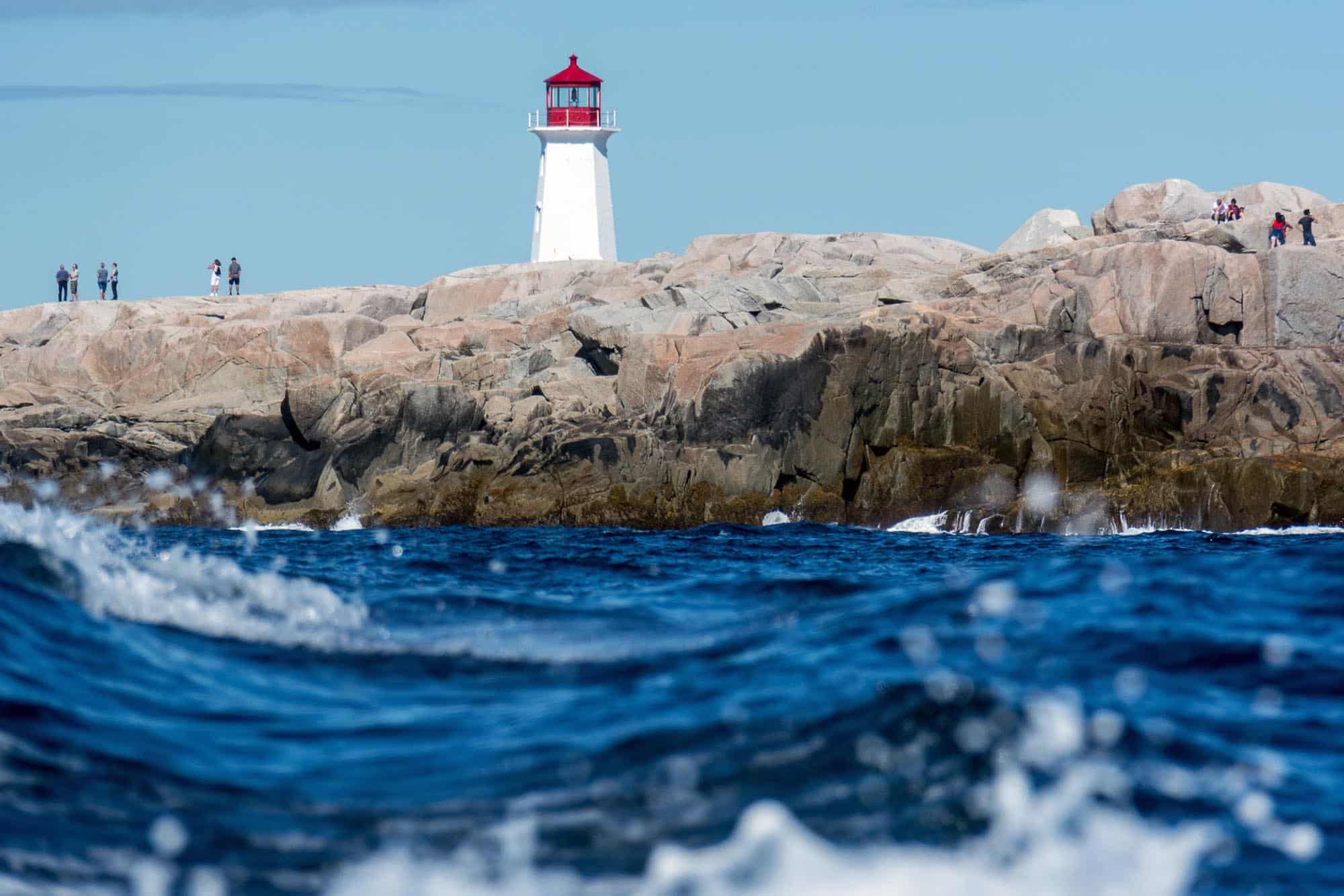 Ocean-level view of the lighthouse at Peggy's Cove, Nova Scotia - image by Picture Perfect Tours and Geordie Mott